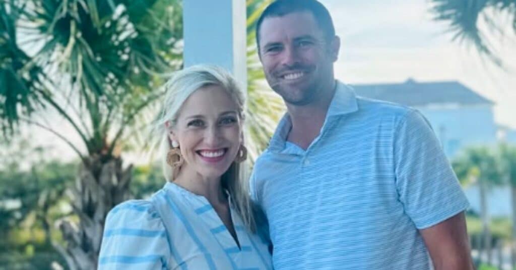 Wesley Bryan and his wife stand side by side, smiling for a photo, capturing a moment of joy and togetherness.