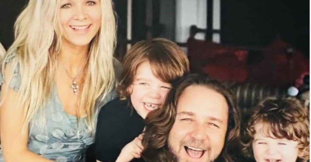 Danielle Spencer and her family of four smile together for a memorable photo, capturing a moment of joy and togetherness.